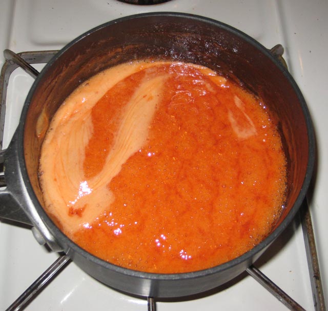 My soopolallie jalapeno jelly turned bright orange on the stove.
