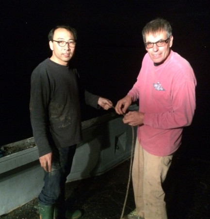Dr. Jang Kim works into the night with seaweed grower Donald King to seed this year's kelp crop.