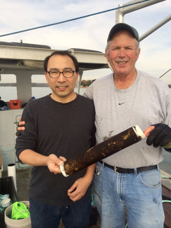Dr. Charles Yarish (right) and Dr. Jang Kim (left) helped two aquaculture farmers seed this year's crop last week in Branford, CT. They are holding a spool of kelp seedstock.