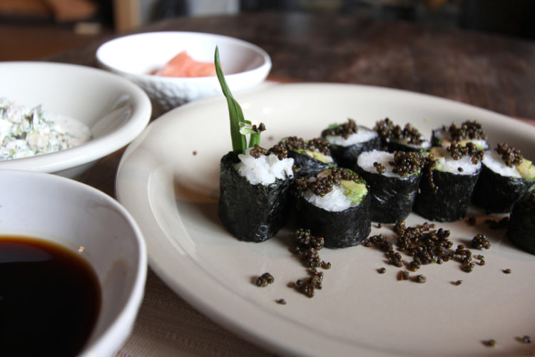 A roll with cooked fish, avocado, wild plants, and tonburi. Photo by Gregg Davis.