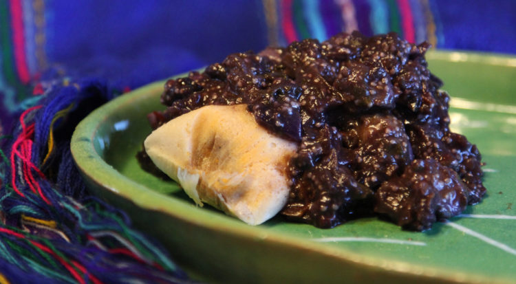 Black nightshade pork green chile over a tamale, yum!